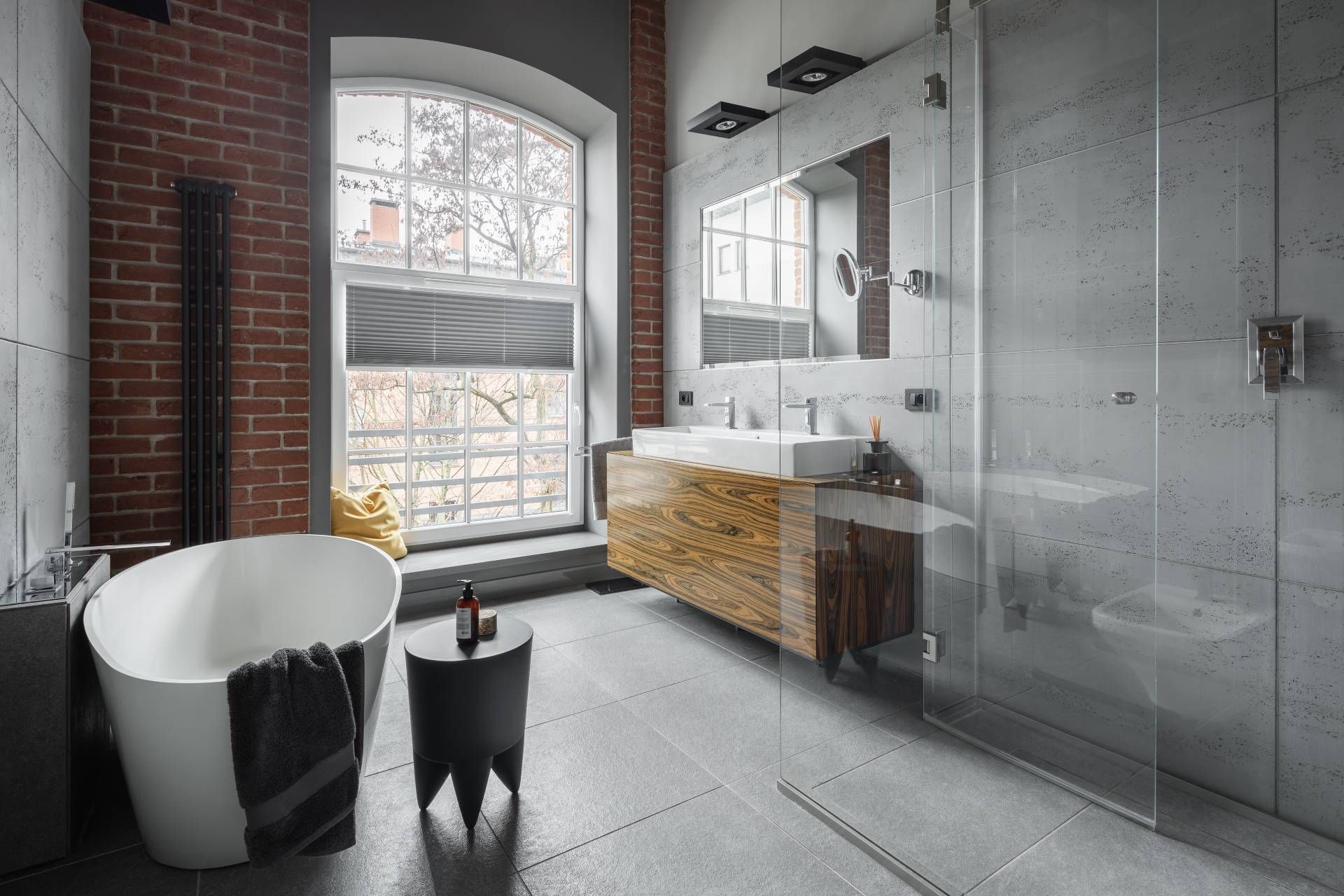 An industrial-style bathroom with a large window Sarasota, FL