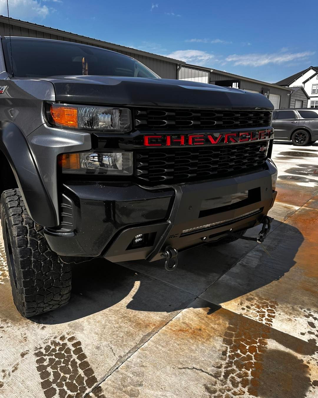 Gray Chevrolet truck with a red 