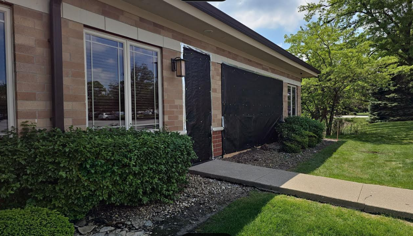 Black roof with gutter system, mounted with dark brackets.