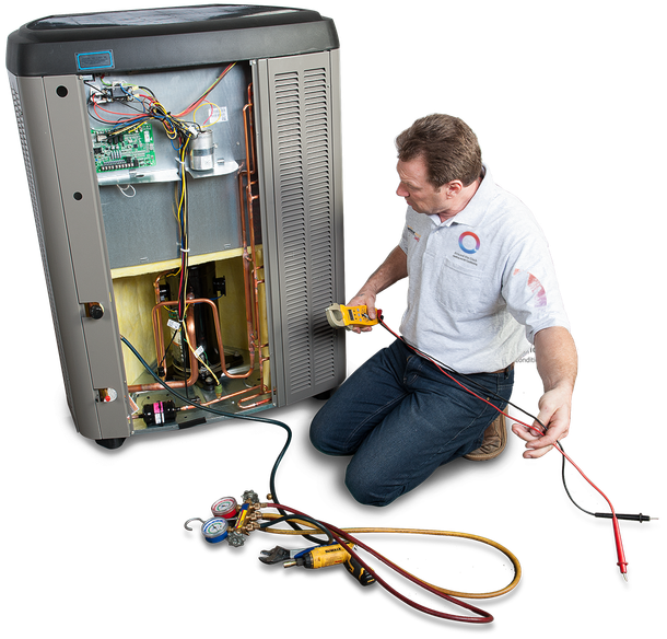 A man is kneeling down in front of an air conditioner