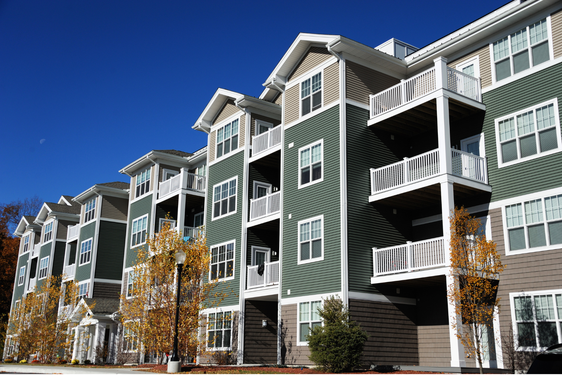 A large apartment building with lots of windows and balconies