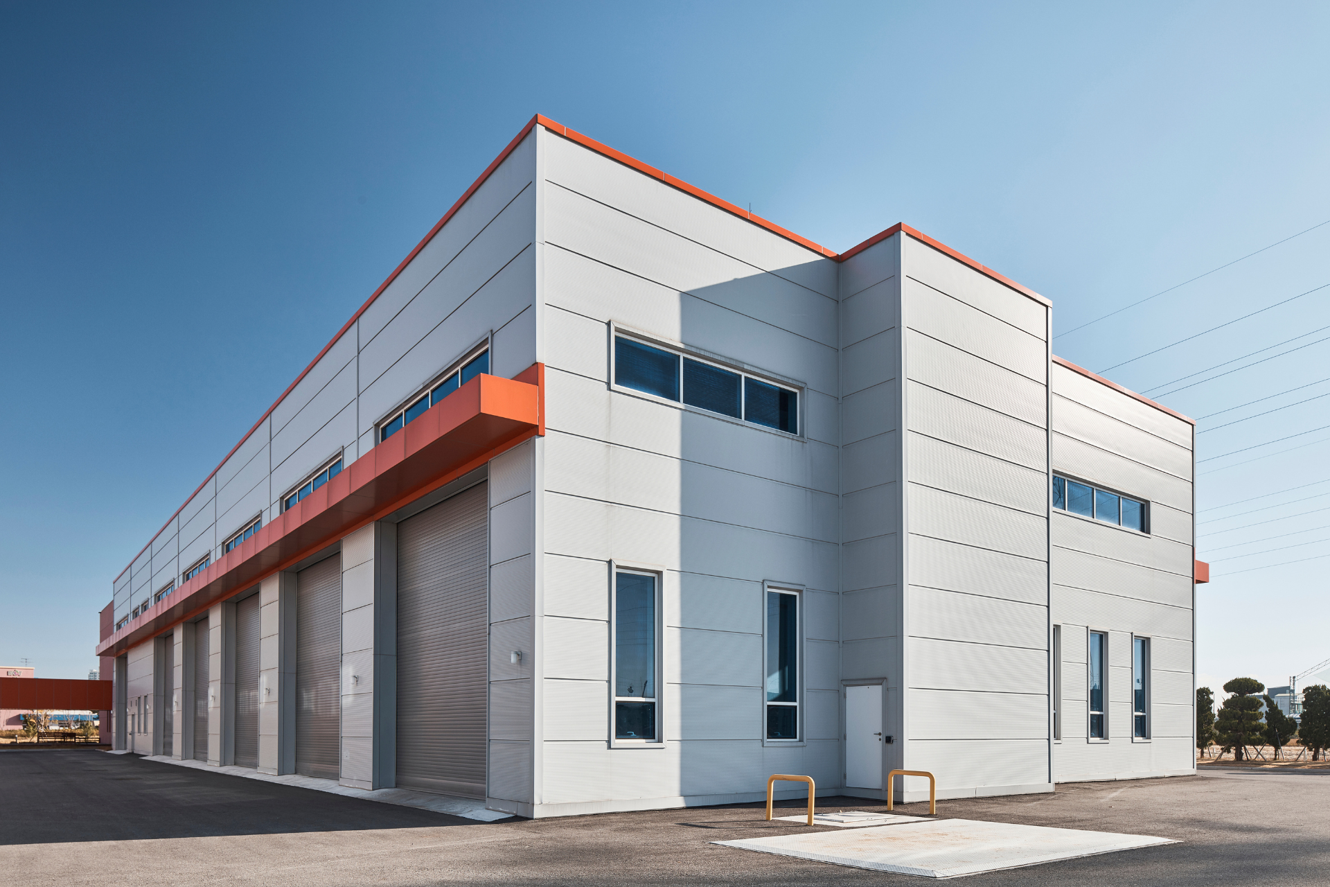 A large white and orange building with a lot of windows