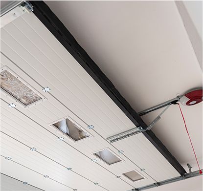 the inside of a garage door with the door open .
