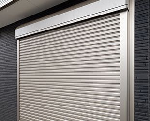 a close up of a garage door on a building .