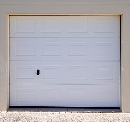 a white garage door with a black handle