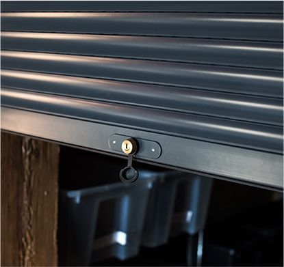 a close up of a garage door with a lock on it .