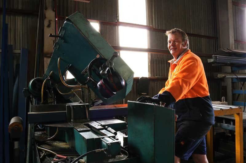 steel and a man working