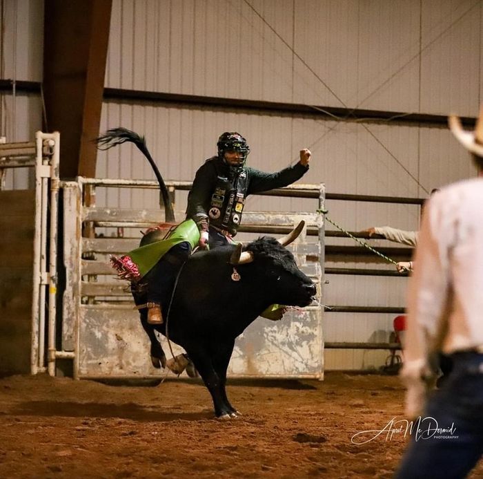 Man Riding A Bull