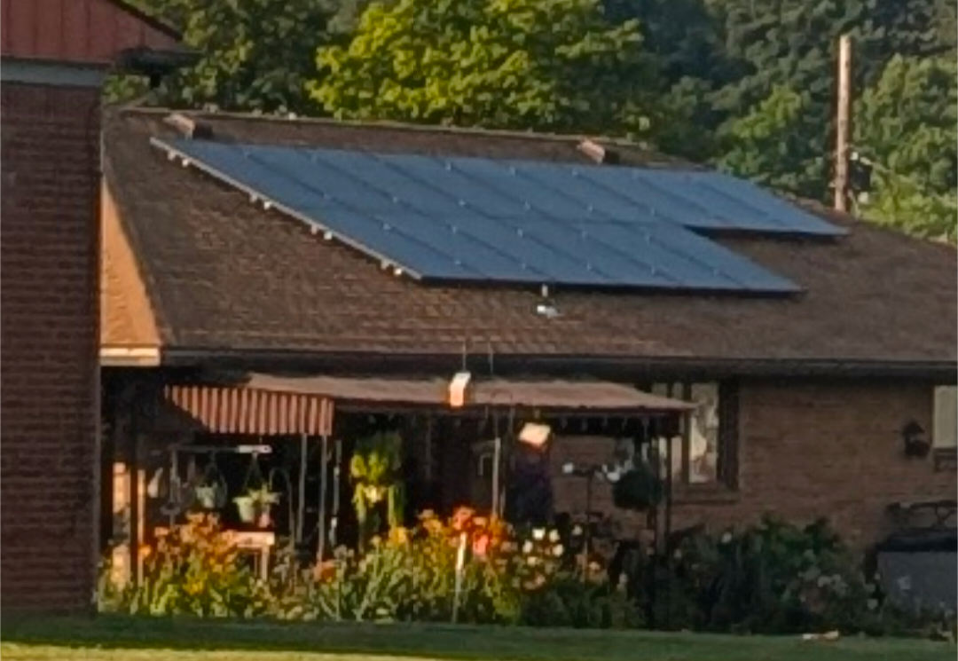 A brick house with solar panels on the roof