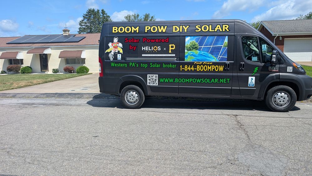 A boom pow diy solar van is parked in front of a house
