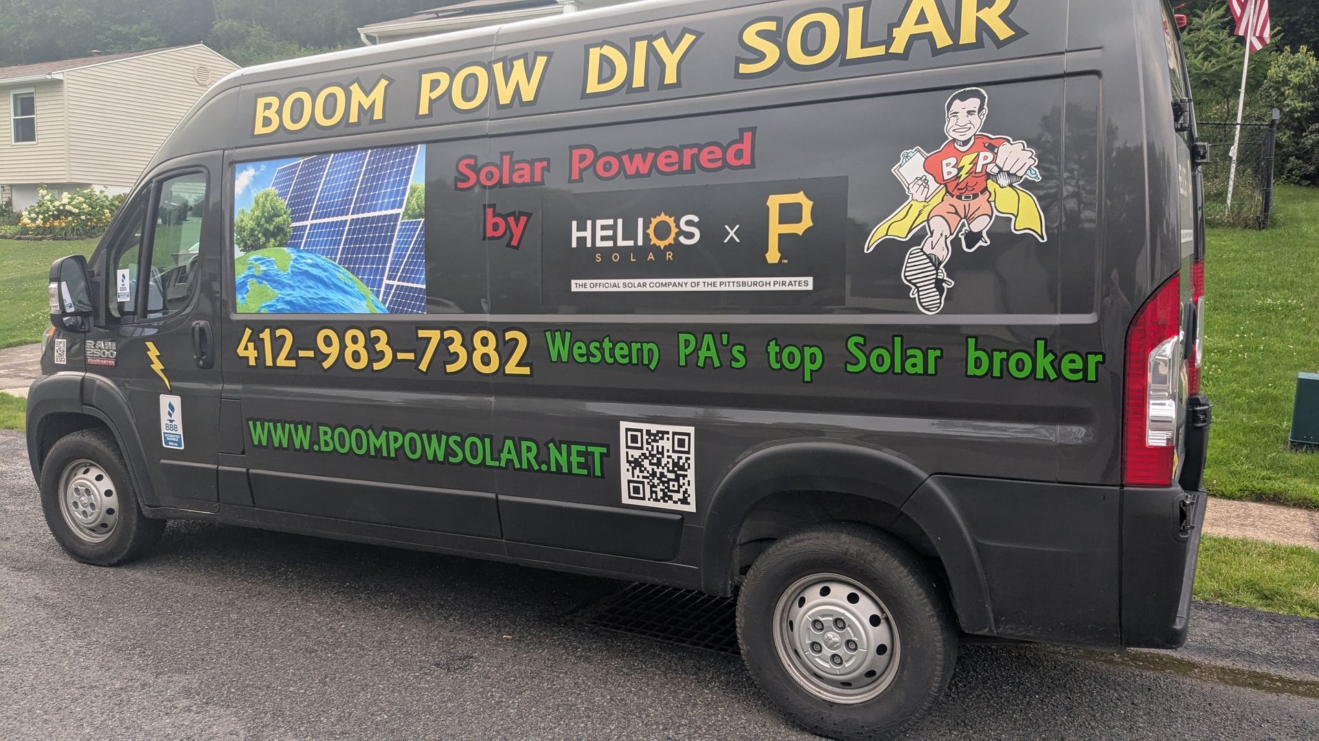 A boom pow diy solar van is parked on the side of the road