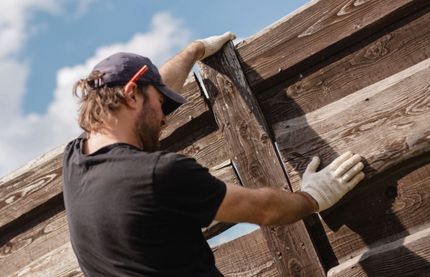 Image of a man fixing a fence in Croydon