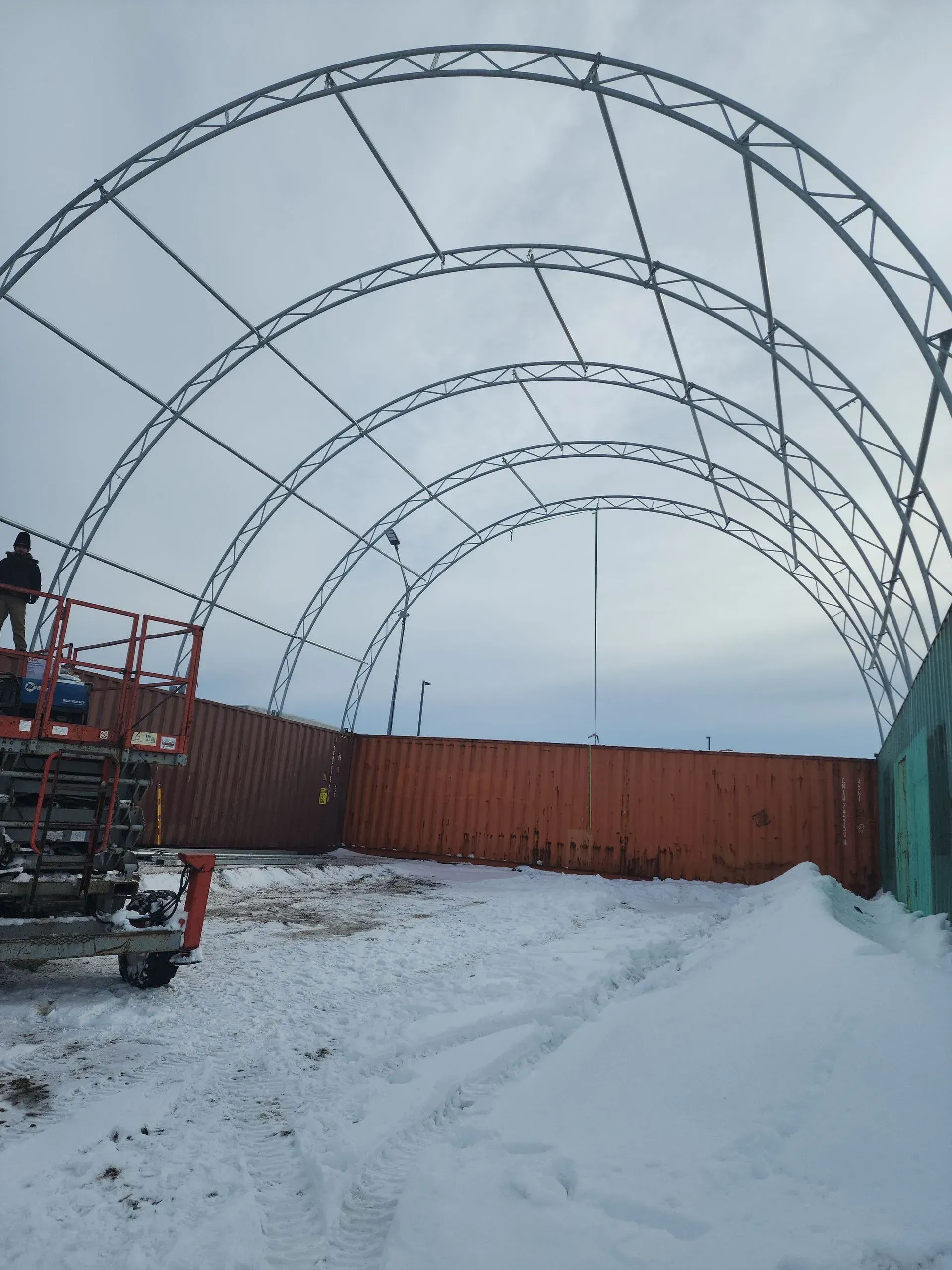 A large structure is being built in the snow