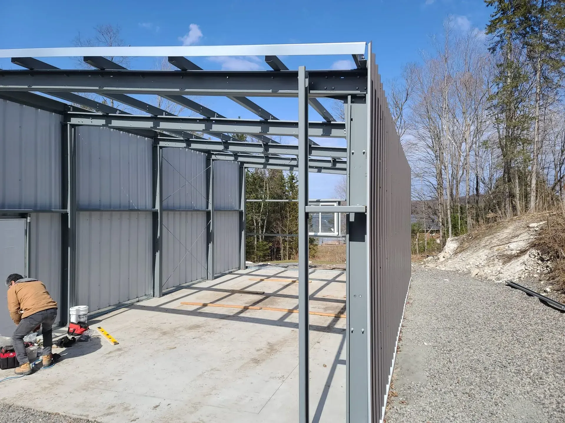 A man is working on a metal structure.