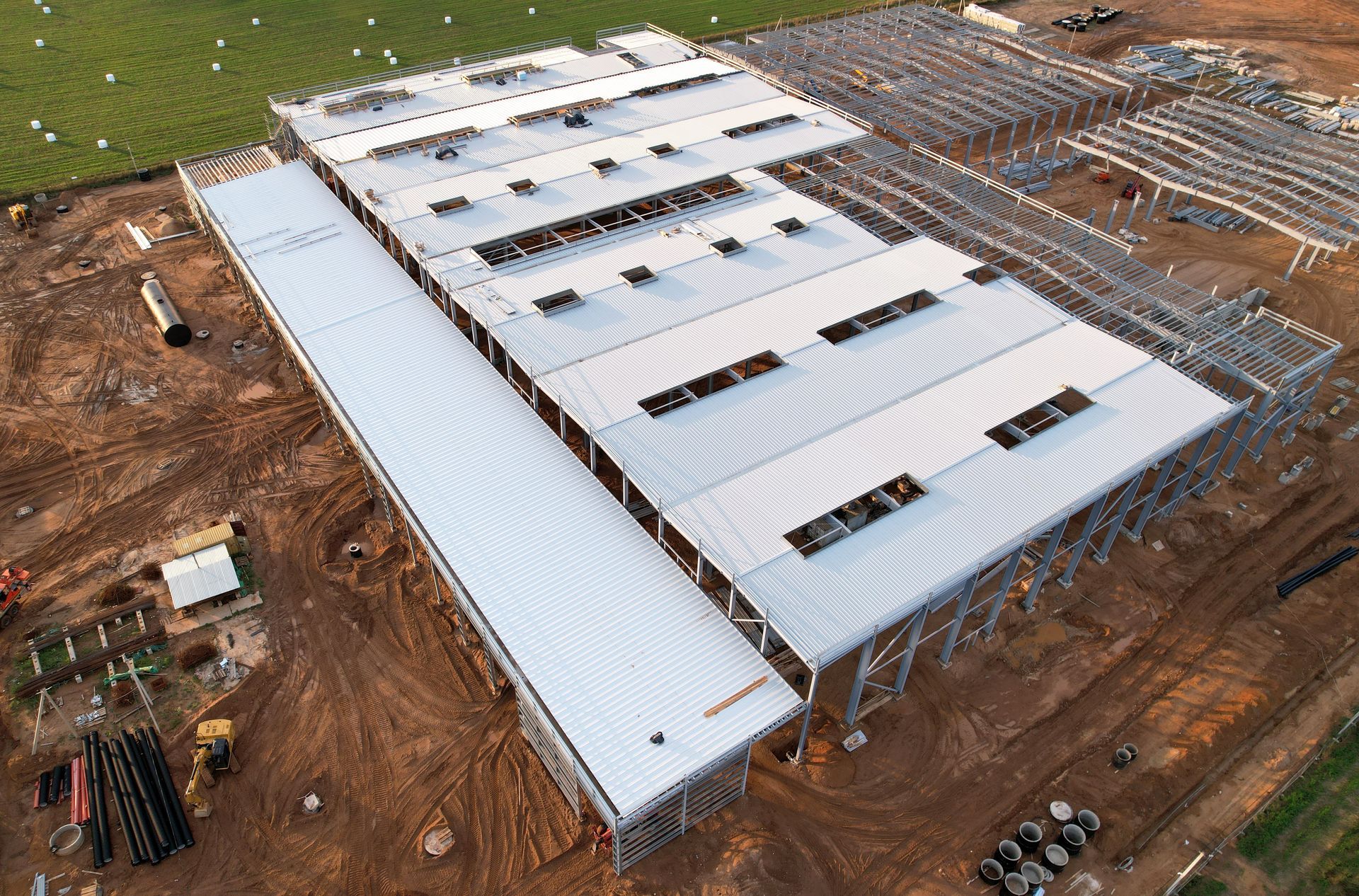 An aerial view of a large building under construction.