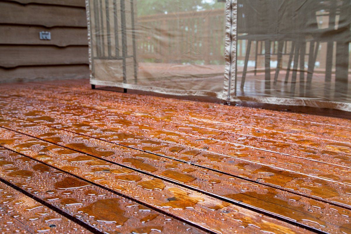 An image of a deck with glistening water droplets, highlighting its remarkable waterproofing capabilities.