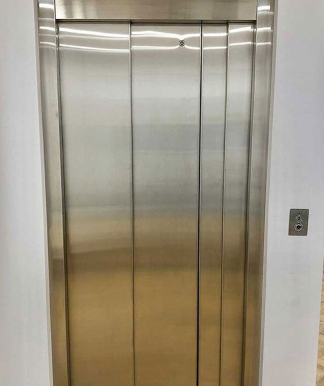 A Stainless Steel Elevator with The Doors Open — Master Lifts Cairns in Cairns, QLD