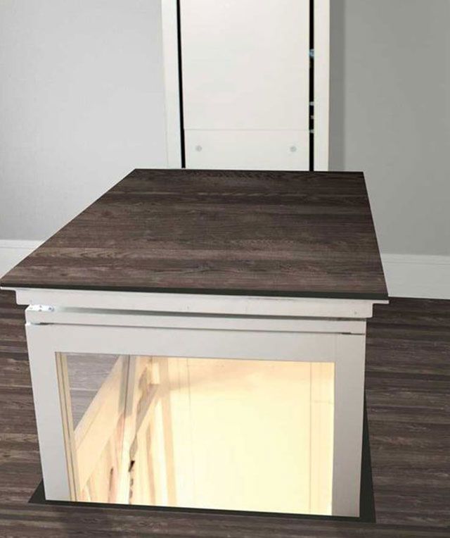 An Elevator with A Wooden Floor and A Glass Door — Master Lifts Cairns in Cairns, QLD