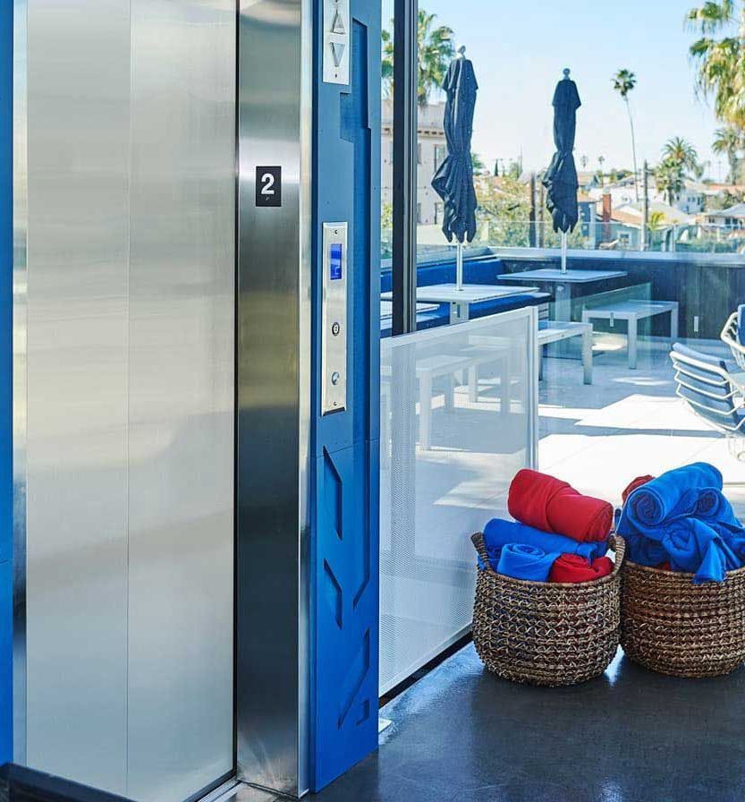 Accessible Elevator With Sign. Disabled Persons Lift Near Modern Apartment Facility — Master Lifts Cairns in Cassowary Coast, QLD