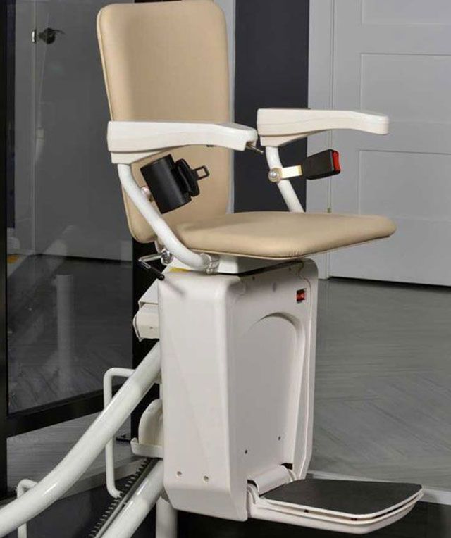 A Stair Lift with A Tan Seat and White Arm Rests — Master Lifts Cairns in Cairns, QLD