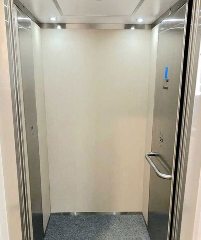 The Inside of An Elevator with Stainless Steel Doors — Master Lifts Cairns in Cairns, QLD