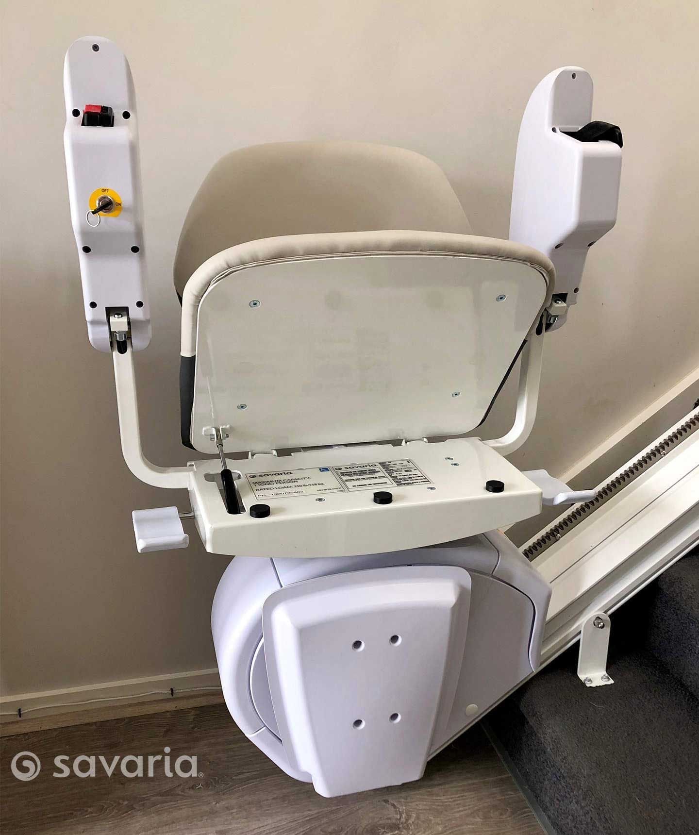 A White Chair Is Sitting on Top of A Set of Stairs — Master Lifts Cairns in Cairns, QLD