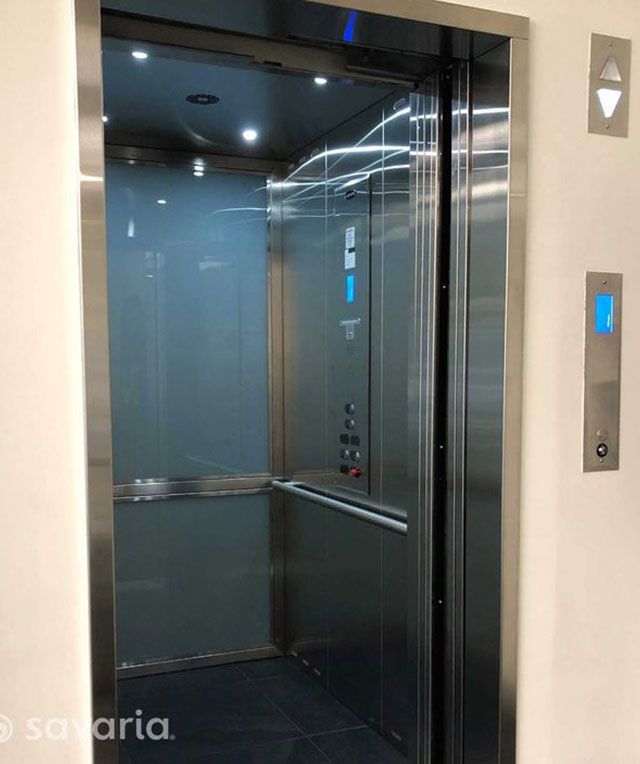A Stainless Steel Elevator with A Glass Door — Master Lifts Cairns in Cairns, QLD
