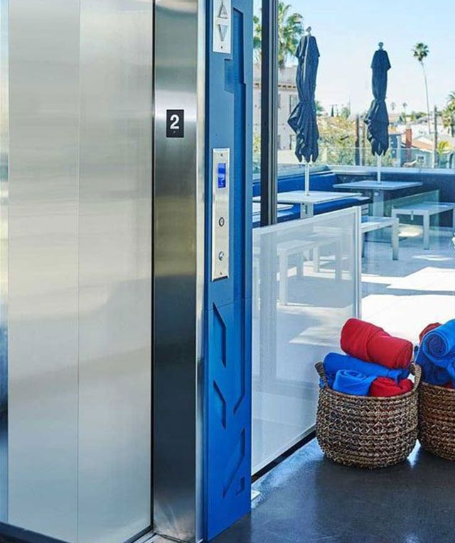 A Blue Elevator with The Number 2 on It — Master Lifts Cairns in Cairns, QLD