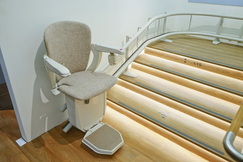 A Chair Is Sitting On Top Of A Set Of Stairs — Master Lifts Cairns in Cairns, QLD