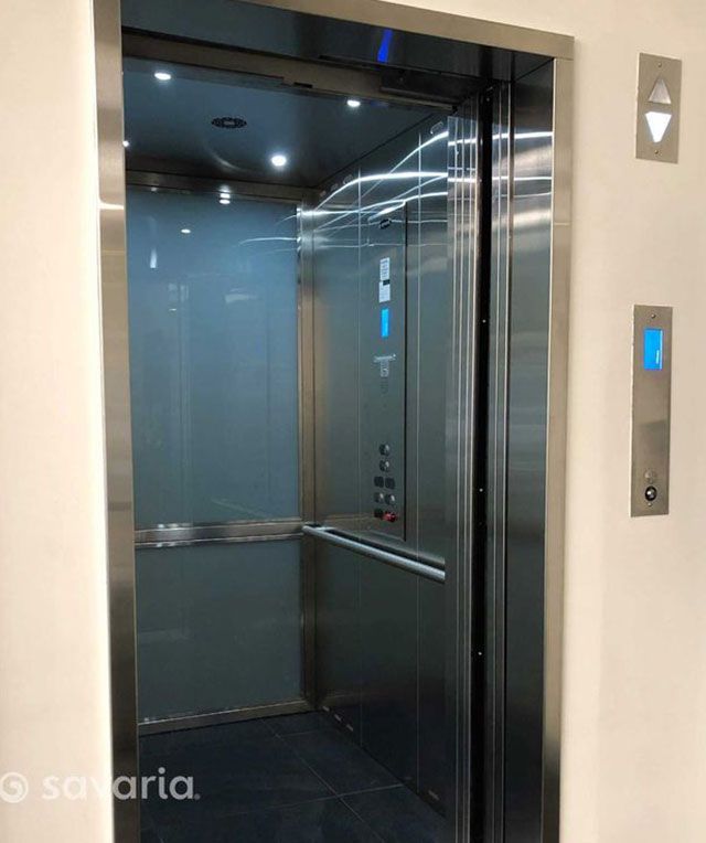 The Inside of A Stainless Steel Elevator with The Door Open — Master Lifts Cairns in Cairns, QLD