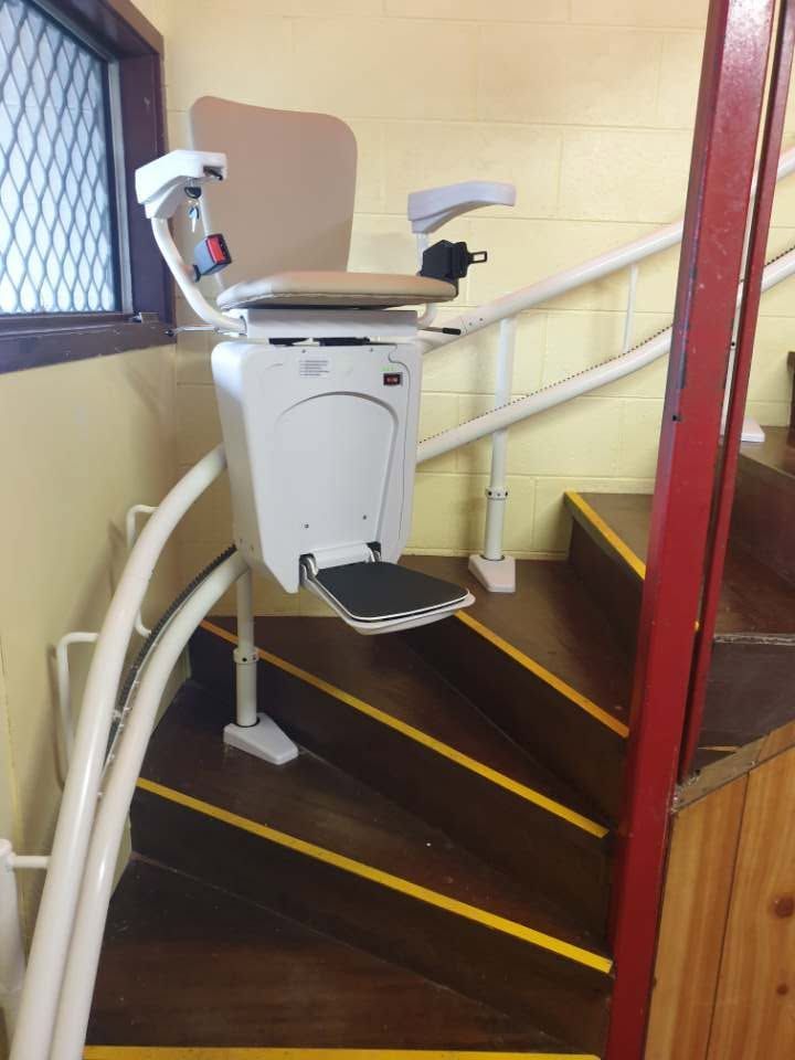 Chair Lift In Cairns Installed On Curved Stairs For Safe, Reliable Home Mobility And Easy Access