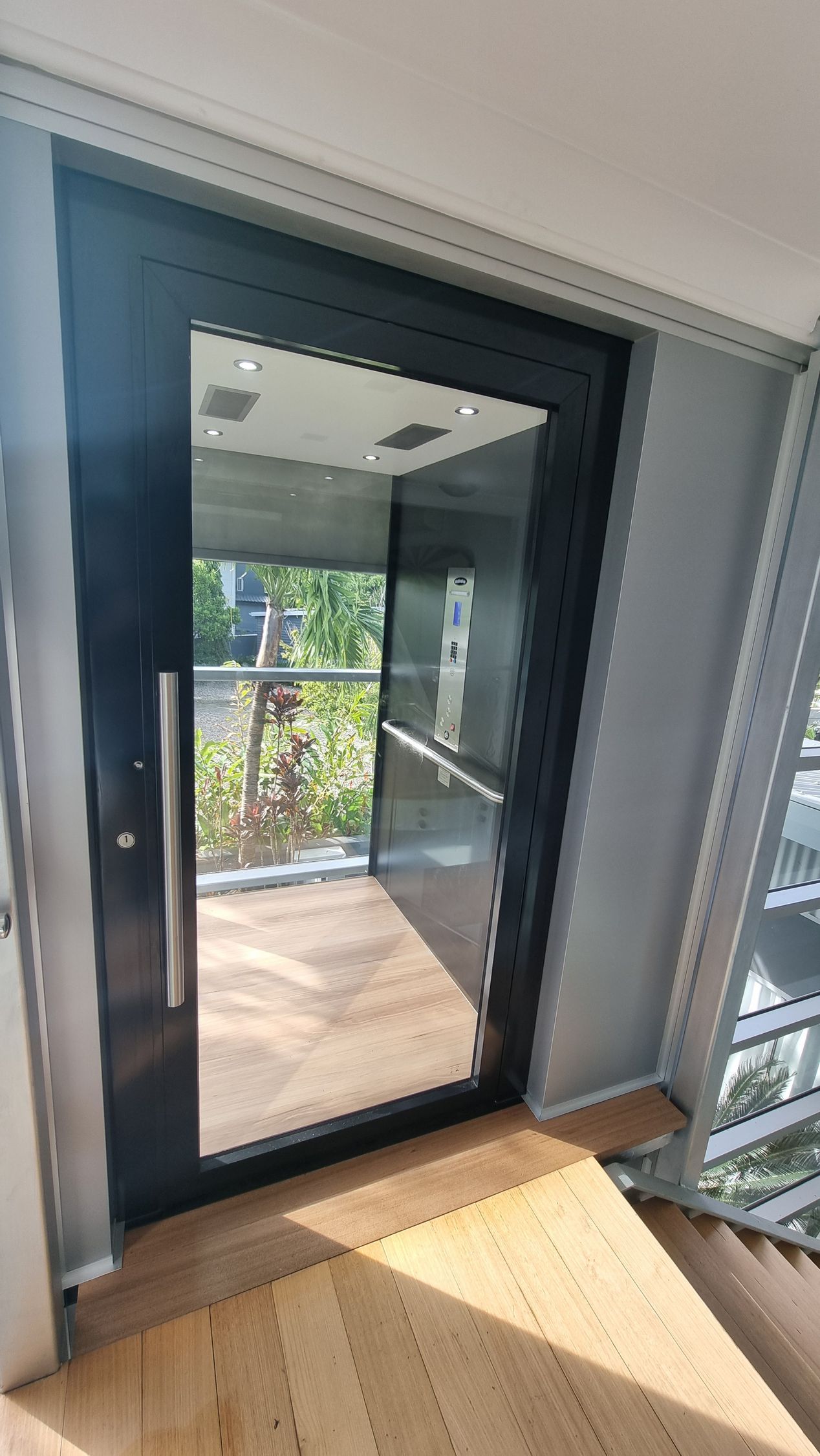 A Door with A Mirror on It Is in A Room with Stairs — Master Lifts Cairns in Cairns, QLD