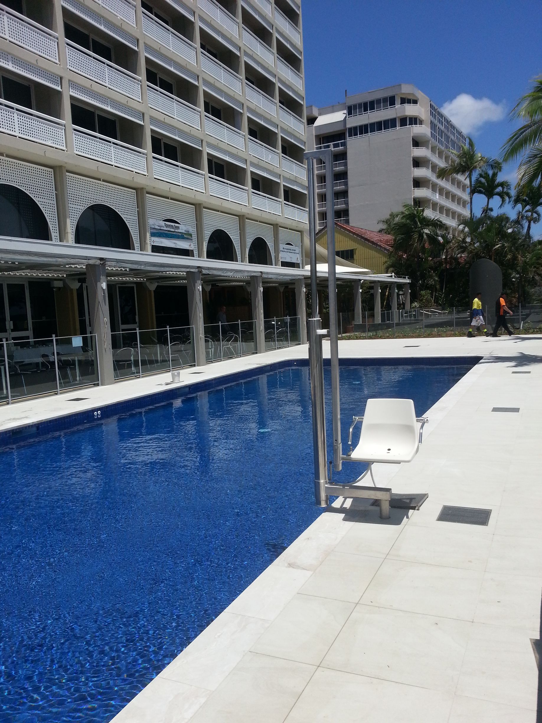 A Large Swimming Pool in Front of A Building — Master Lifts Cairns in Cairns, QLD