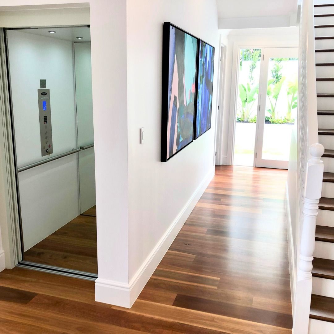 A Hallway with A Staircase and An Elevator — Master Lifts Cairns in Cairns, QLD
