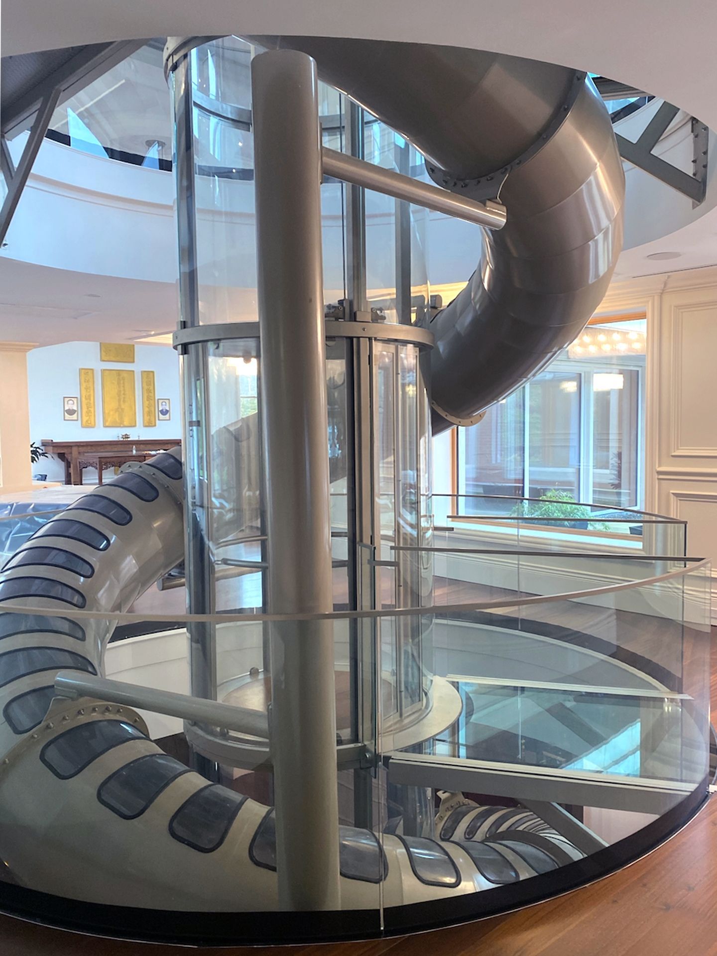 A Spiral Staircase with A Slide in The Middle of It — Master Lifts Cairns in Cairns, QLD