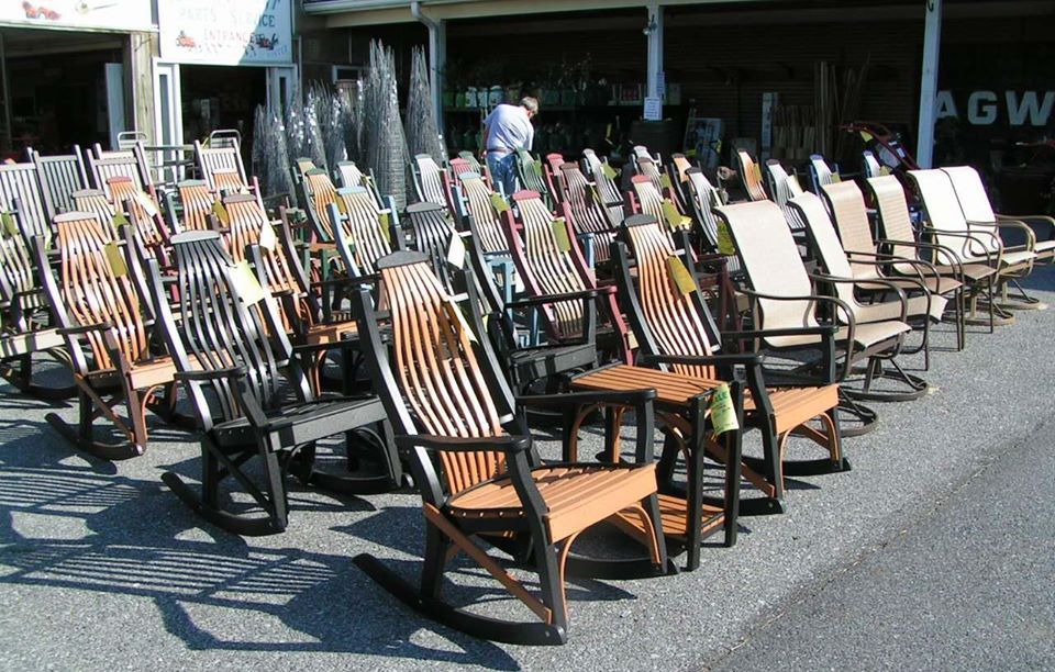 Rows of outdoor rocking chairs for sale.