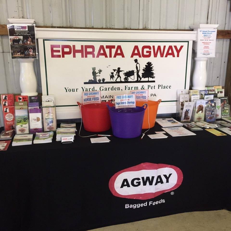Ephrata Agway store display: table with products, buckets, and sign 