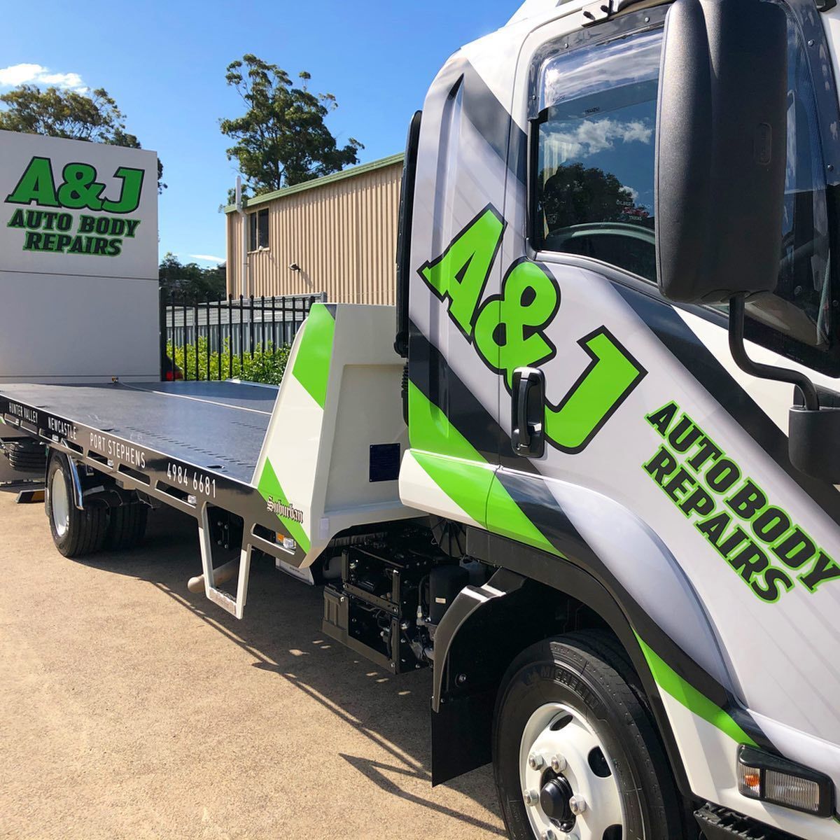 A White and Green Truck That Says A & J Auto Body Repairs — A & J Auto Body Repairs In Muswellbrook, NSW