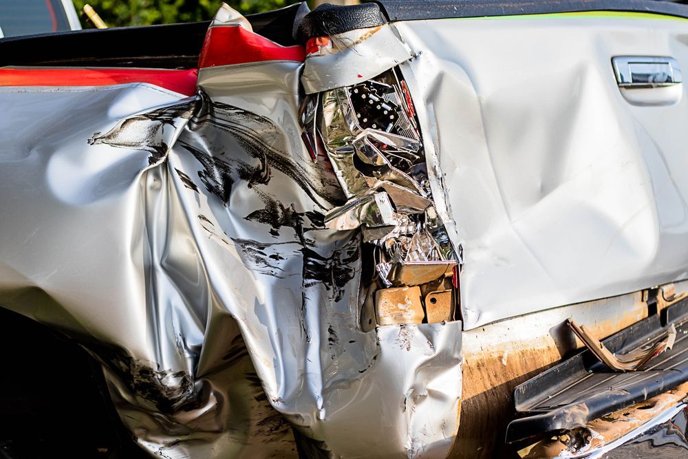 A Close Up of a Damaged Truck With a Broken Tail Light — A & J Auto Body Repairs In Port Stephens, NSW