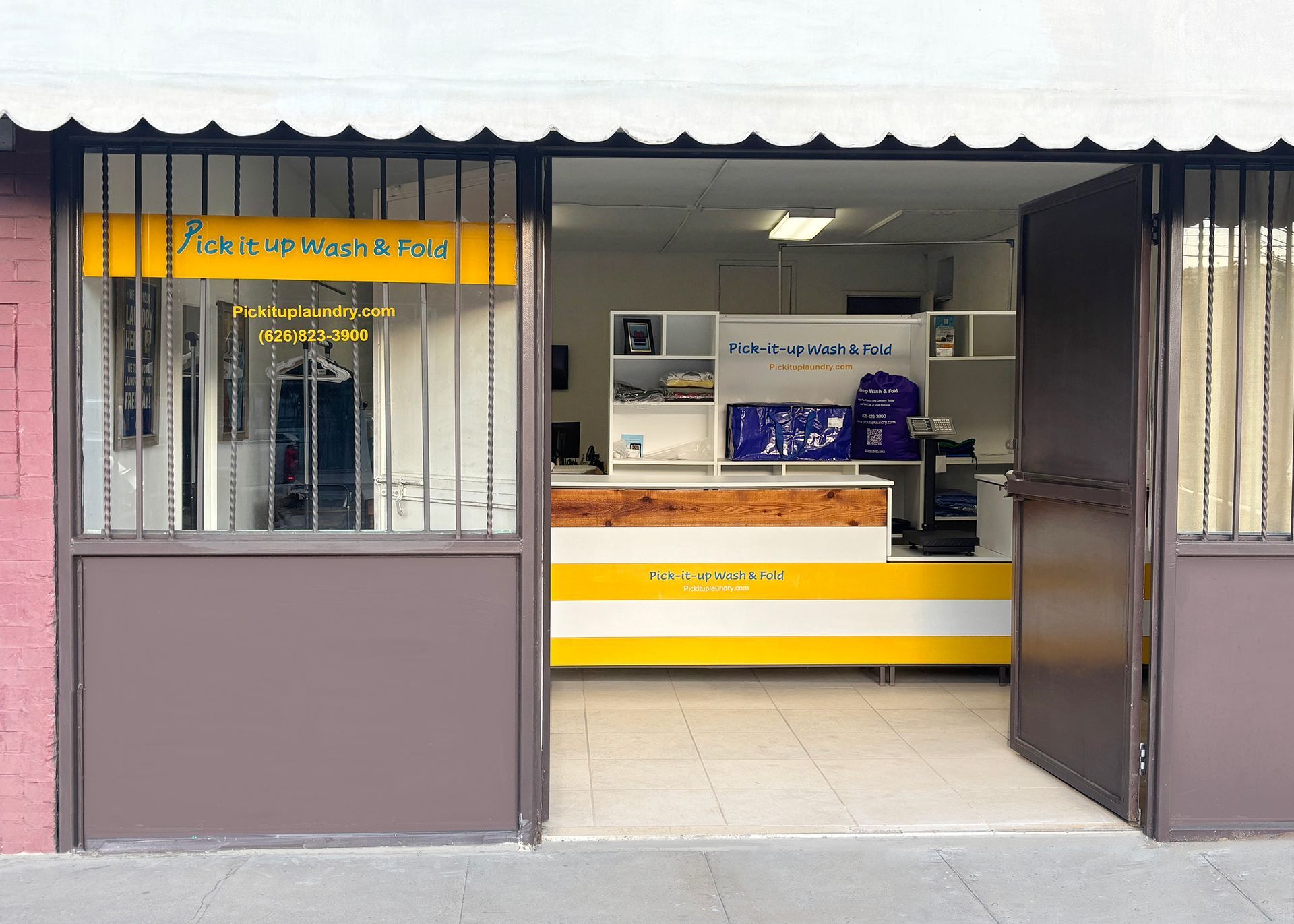 Purple laundry bag with drawstring, labeled 