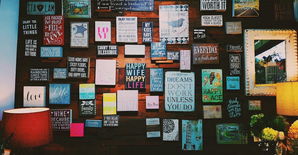 A wall with a lot of signs on it including one that says happy wife happy life.