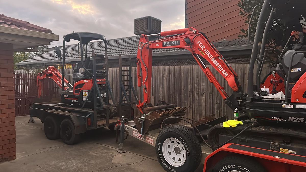 Mini excavators on trailers