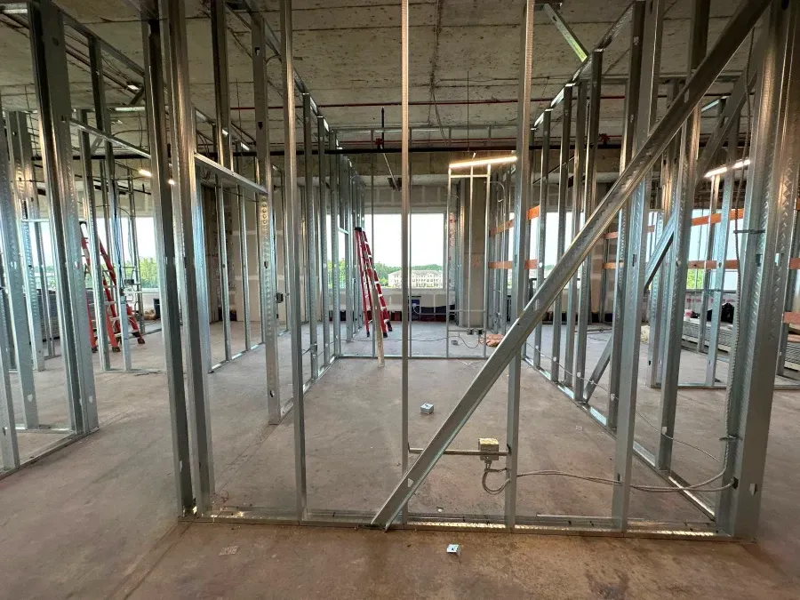 Metal framing for interior walls in a construction site.