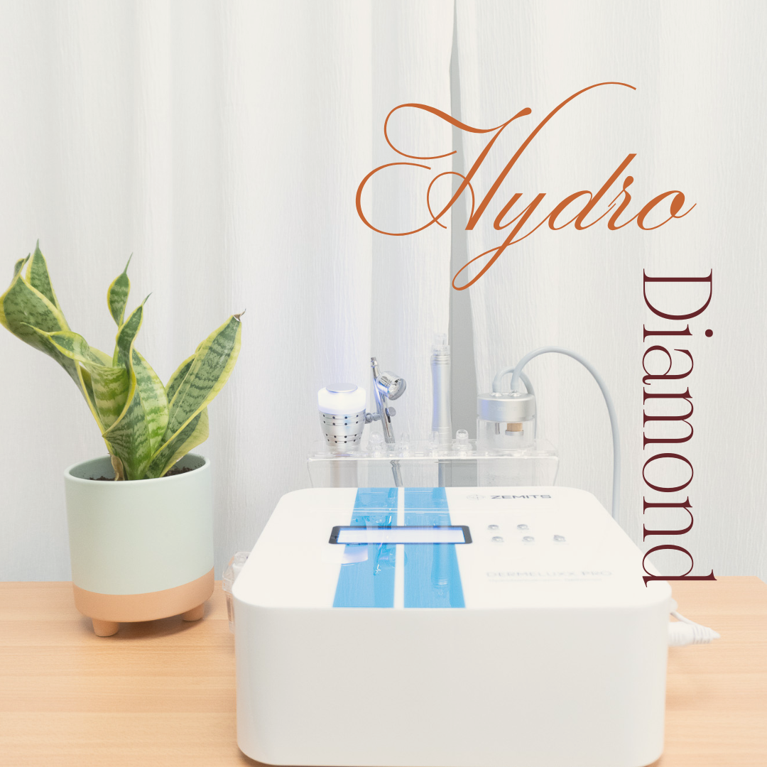 A hydro diamond machine is sitting on a wooden table next to a potted plant.