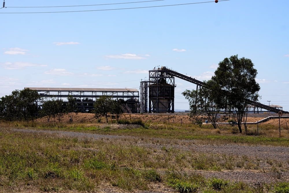 A Coal Mine Warehouse Is Sitting In The Middle Of A Field — AMC Diesel Fuel Injection Services In Moranbah, QLD