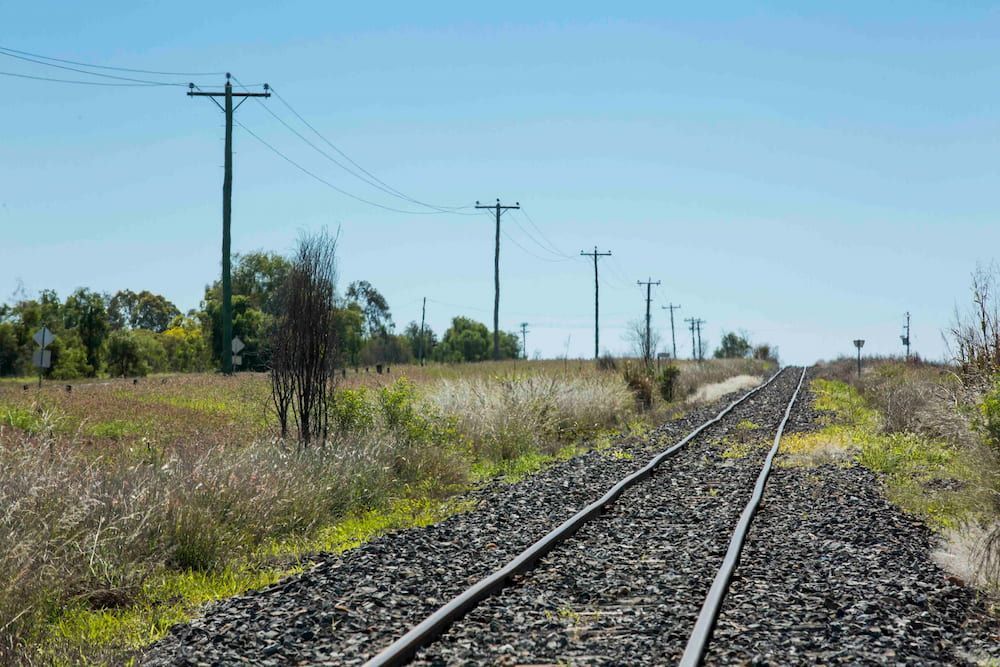 A Train Track Going Through A Grassy Field — AMC Diesel Fuel Injection Services In Emerald, QLD