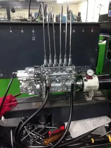 A Close Up Of A Car Engine With The Hood Open — AMC Diesel Fuel Injection Services In Bowen, QLD