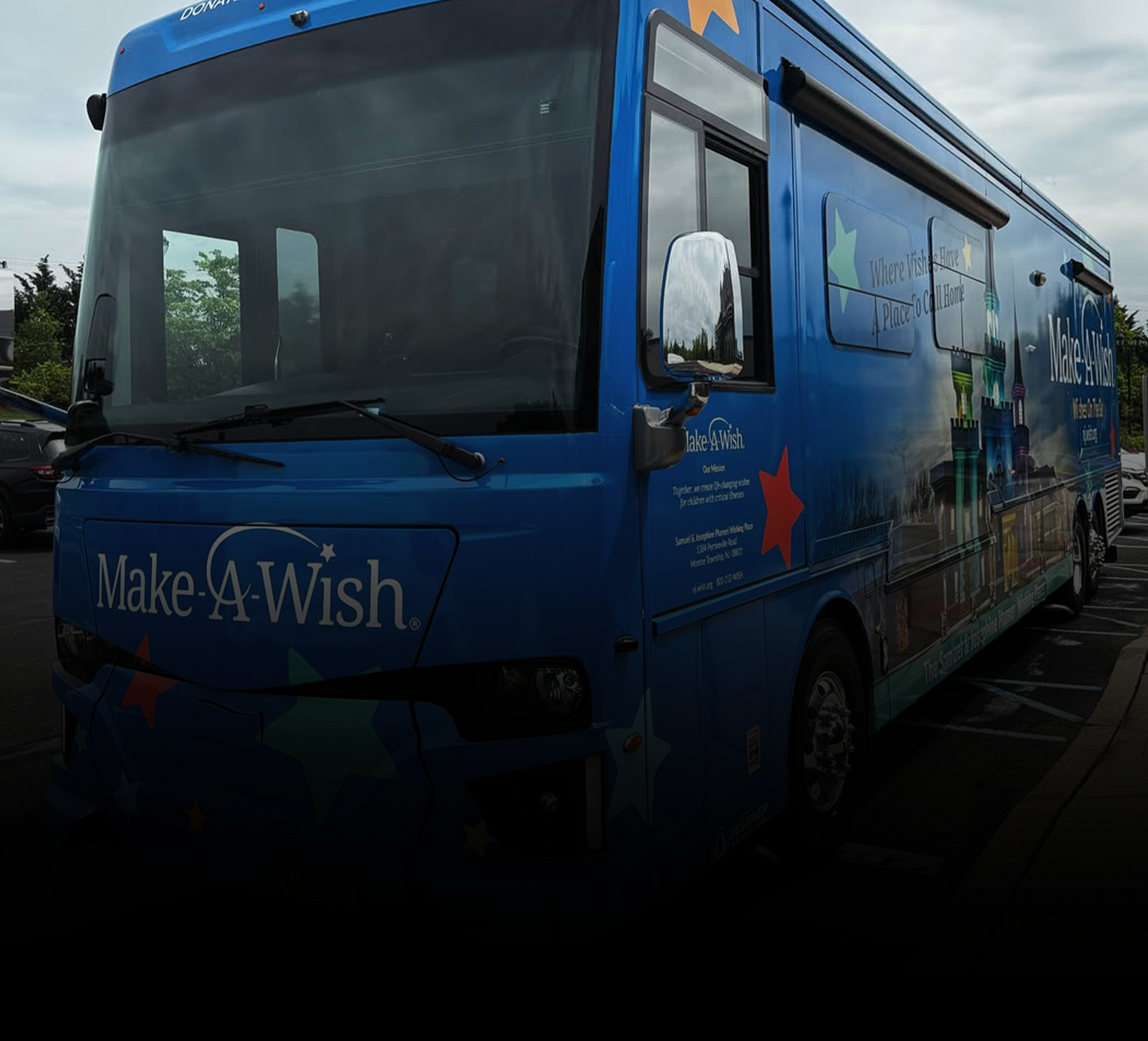 Make-A-Wish Foundation bus freshly detailed with a clean, polished blue exterior by CC Cleaning & Detailing NJ.