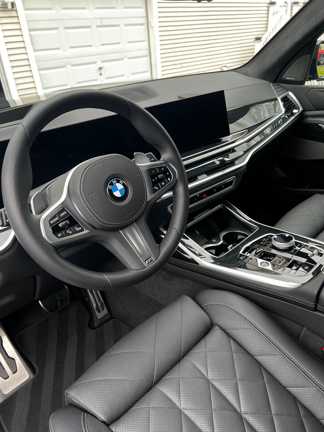 BMW interior dashboard and console after professional interior detailing service.