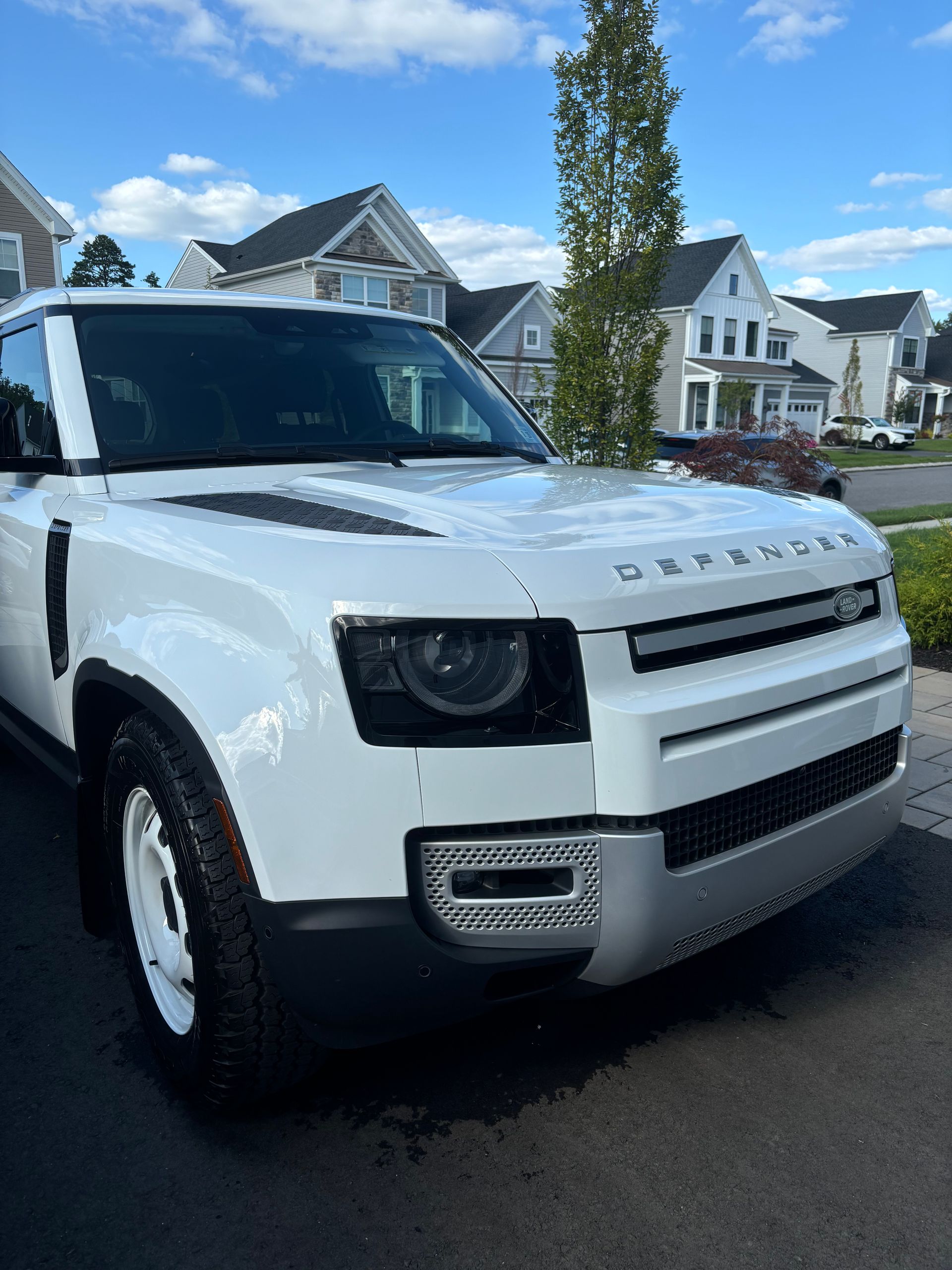 Land Rover Defender exterior freshly detailed with high-gloss ceramic coating finish.